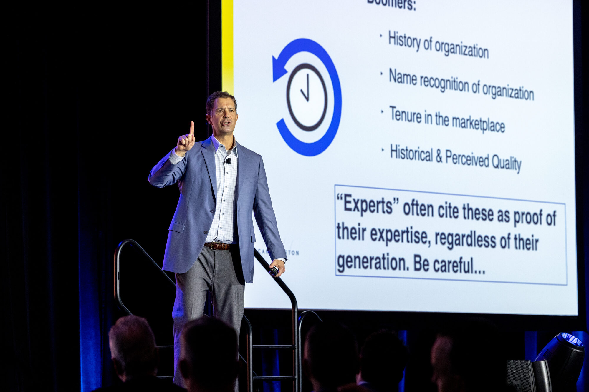 Cam Marston speaking on stage
