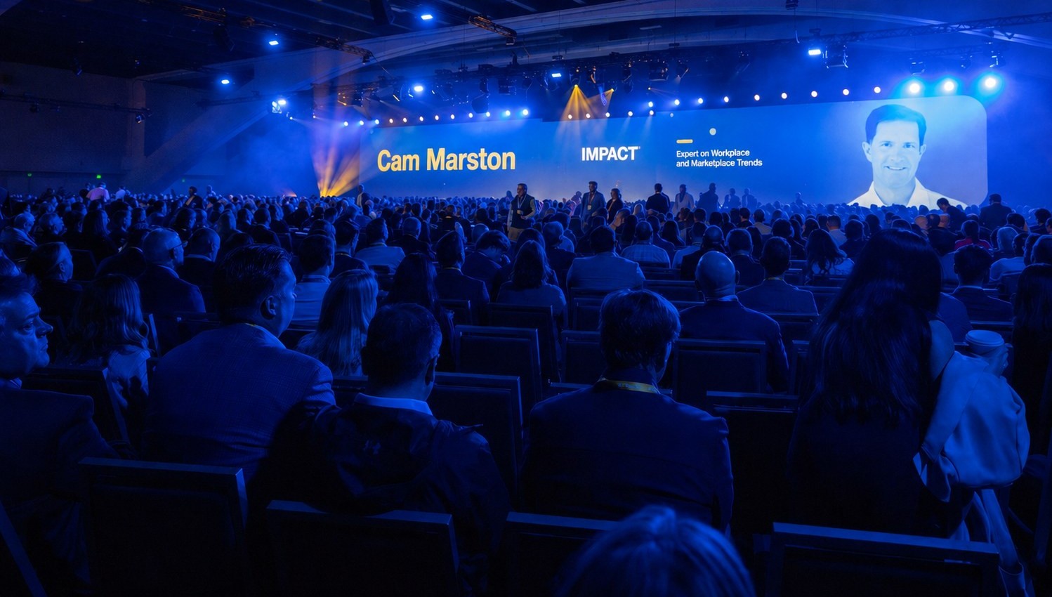 Cam Marston speaking to a large audience